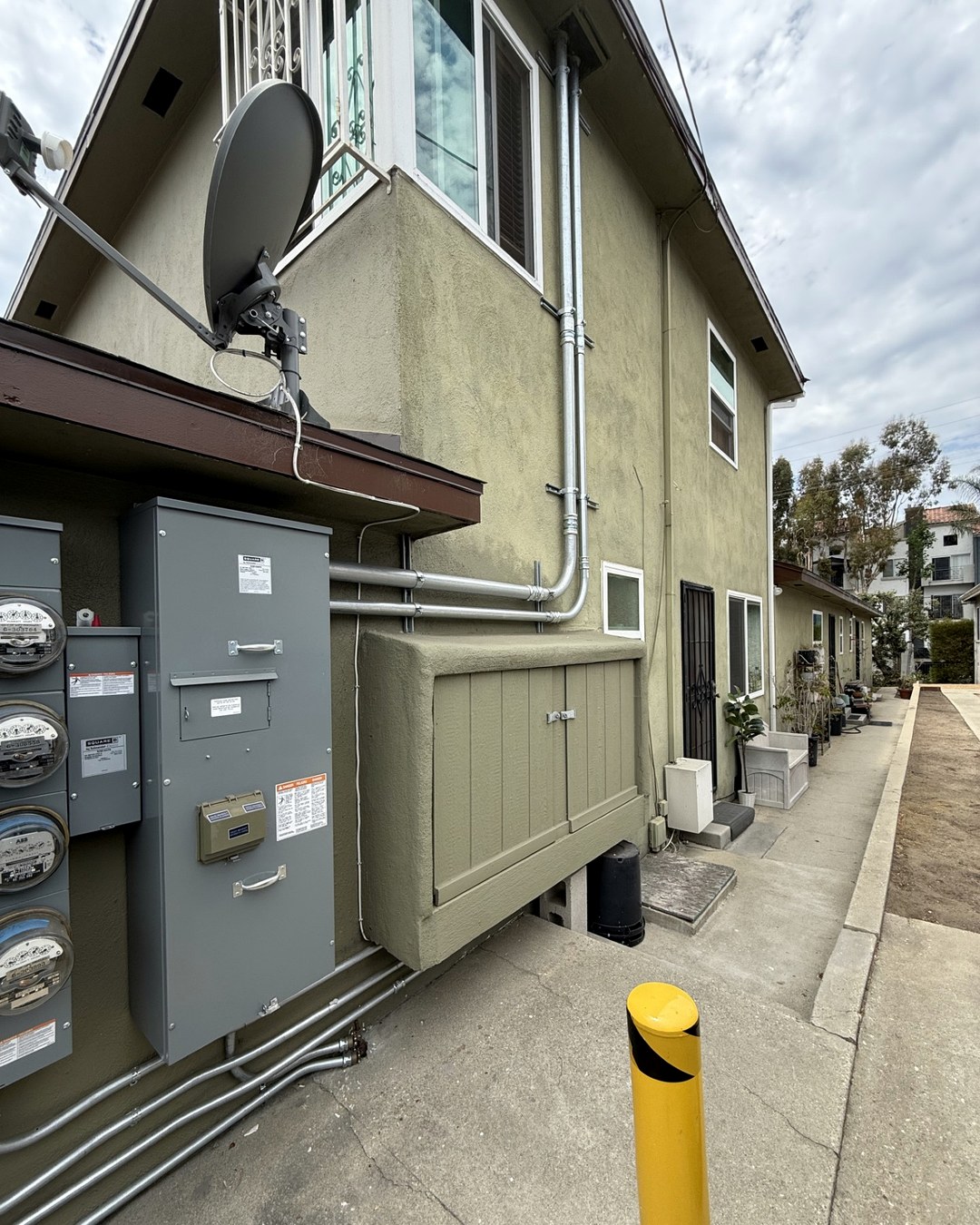 Exterior commercial electrical service equipment and metal conduit from a Bravo project.
