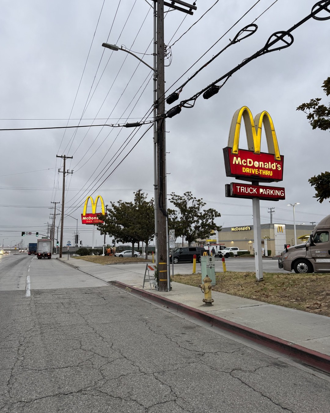 Multiple McDonald's arch signs visible across one commercial property.